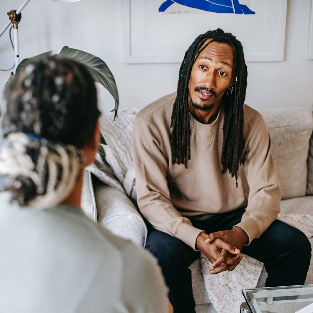 African American man talking to counselor